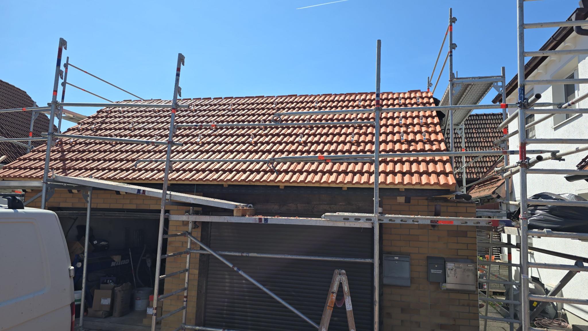 garage roof after renovation, with roof hooks in place